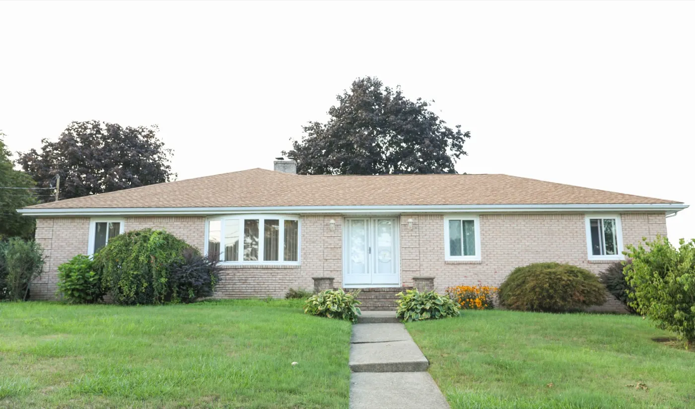 Long, low tan brick ranch house
